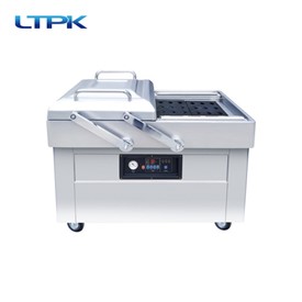 Double chamber vacuum packaging machine
