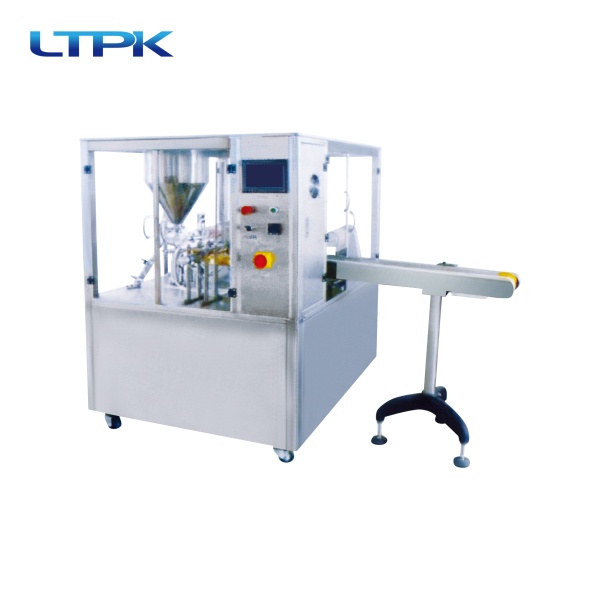 Rotating cup filling and sealing machine