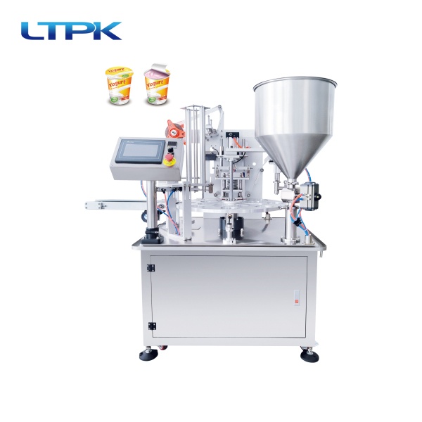 Rotary cup filling and sealing machine