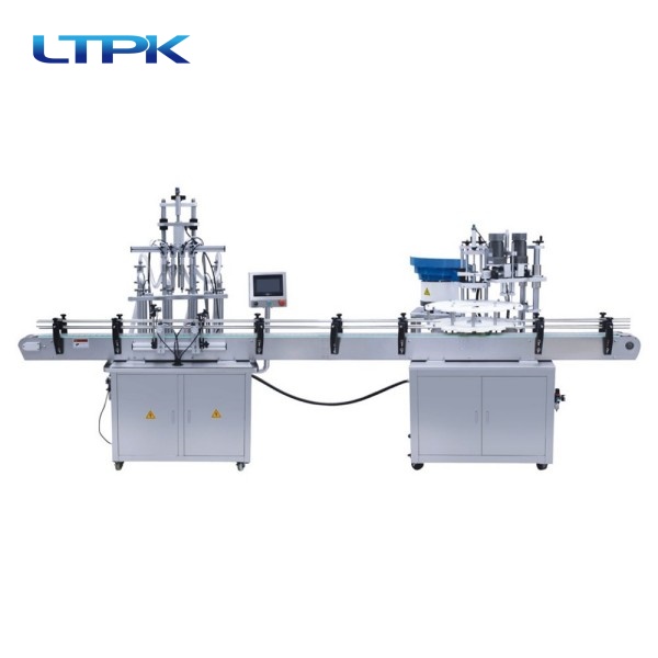 Four-head liquid filling machine +turntable drop cap screwing machine